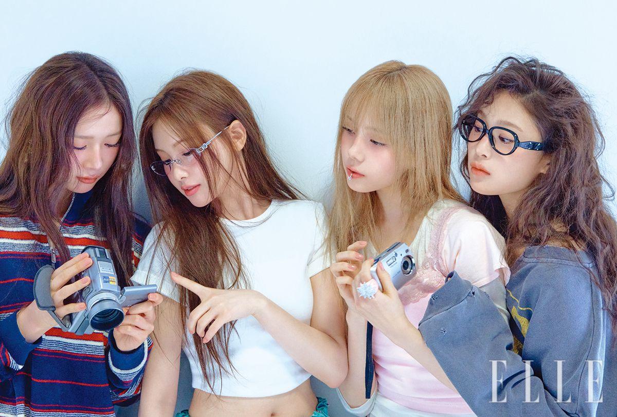 쿠미가 입은 스트라이프 니트는 Miu Miu. 화이트 레이스 스커트는 Yuhan Wang. 이어링은 Yvmin. 이현이 입은 플라워 패턴의 스커트는 Shushu/Tong. 스터드 레더 벨트는 August Barron. 화이트 톱과 아이웨어는 모두 스타일리스트 소장품. 