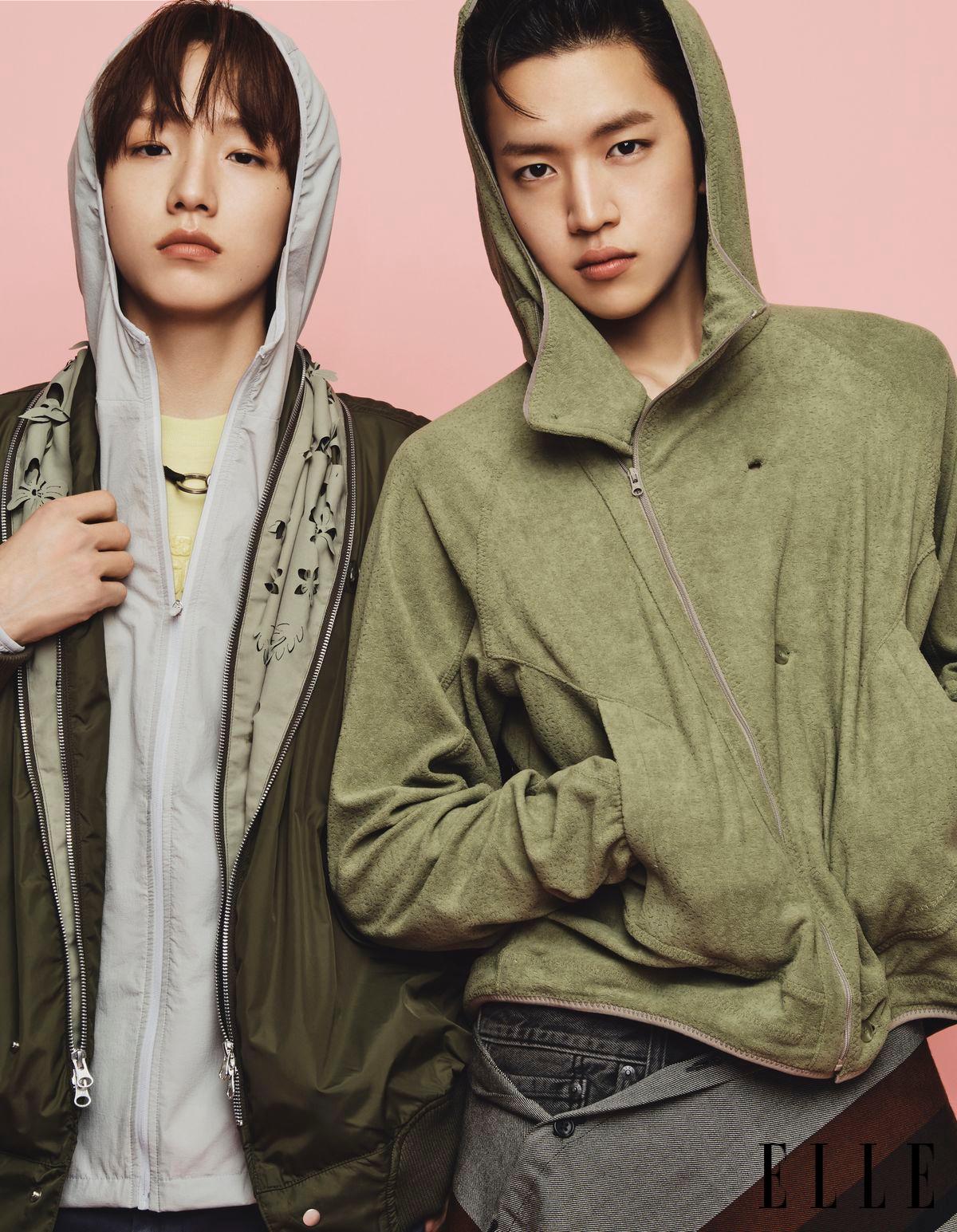 세민이 입은 봄버 재킷은 Juntae Kim by Adekuver. 아노락 점퍼는 San San Gear. 티셔츠는 Onitsuka Tiger. 목걸이는 스타일리스트 소장품. 민재가 입은 재킷은 San San Gear. 쇼츠는 Levi's. 허리에 두른 숄은 Engineered Garments. 