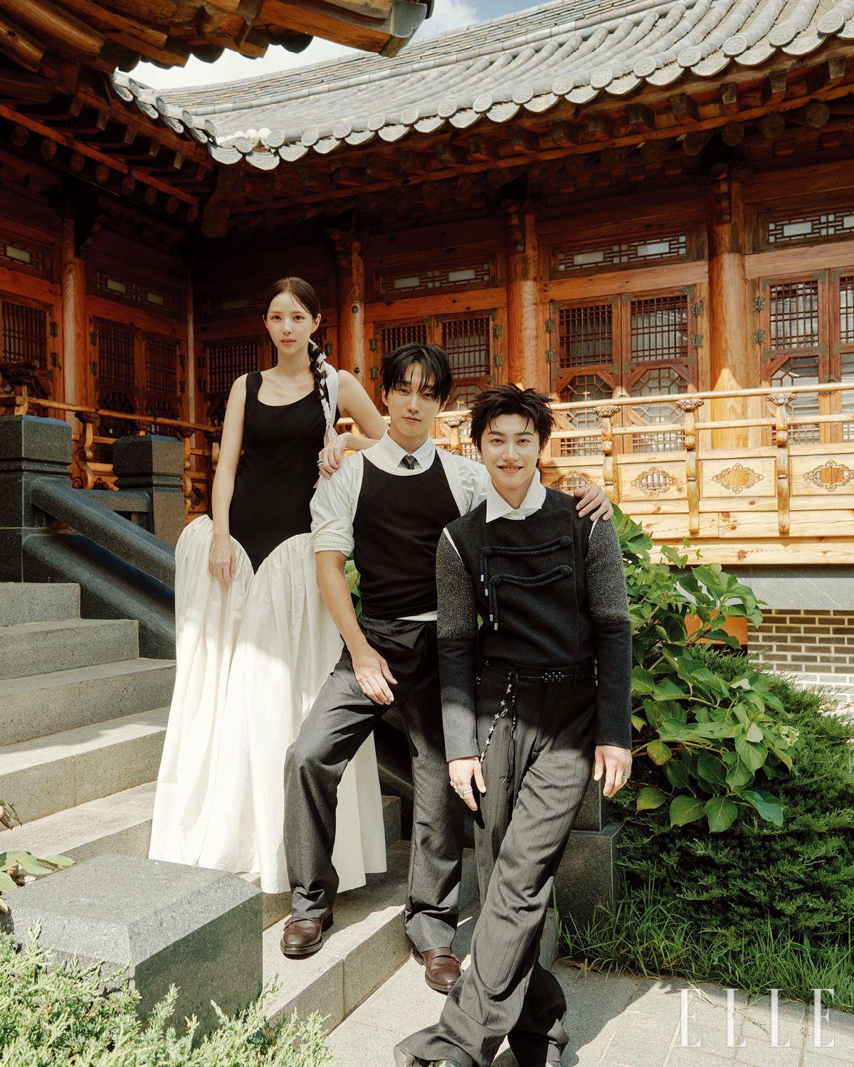 수빈이 입은 벌룬 핏의 드레스는 Jinsun. 댕기와 옥반지는 모두 Hanboklynn. 진영이 입은 셔츠는 Loro Piana. 슬리브리스는 Ych. 팬츠는 Dadada Hanbok. 슈즈는 Ferragamo. 레더 타이는 Our Legacy. 동연이 입은 톱은 Junwei Lin. 이어 커프는 Chrome Hearts. 오른손에 착용한 검지와 소지의 링은 모두 Tiffany & Co. 중지에 착용한 링은 Alexander McQueen. 약지에 착용한 링은 HanO. 팬츠와 슈즈, 벨트, 왼손에 착용한 링은 모두 스타일리스트 소장품.